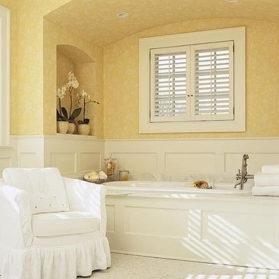 Bright bathroom with tub set in an arched alcove
