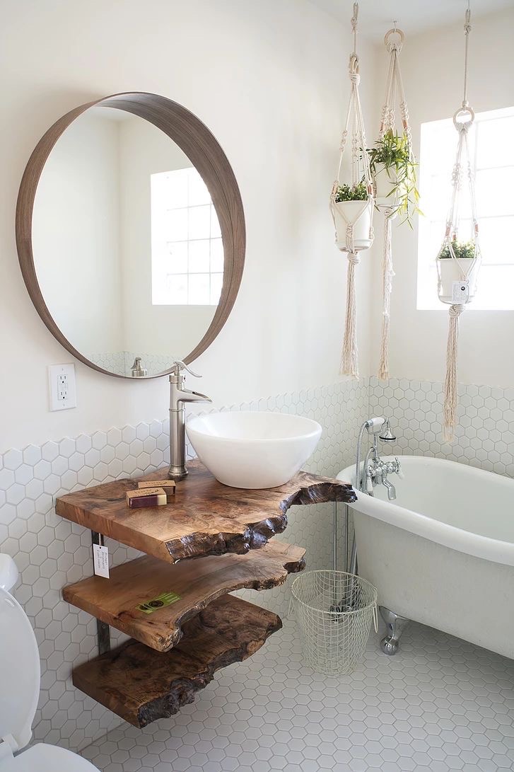 Bright bathroom with a live-edge wood vanity and freestanding tub